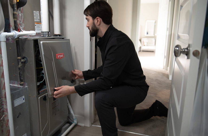 HVAC Technician doing a a system check