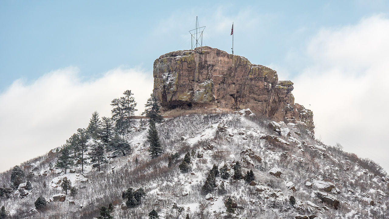 castle rock mountain with a dusting of snow on it