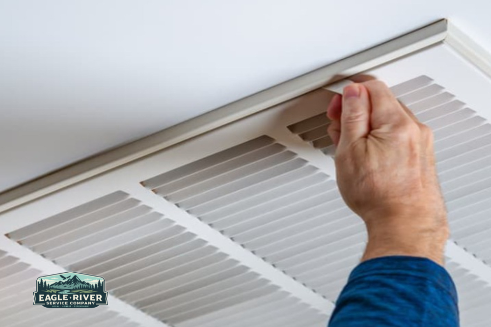 Hand opening air vent in a home in Parker, CO