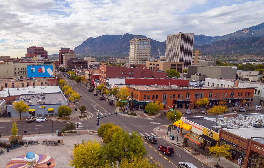 photo of downtown colorado springs with mountains in the background