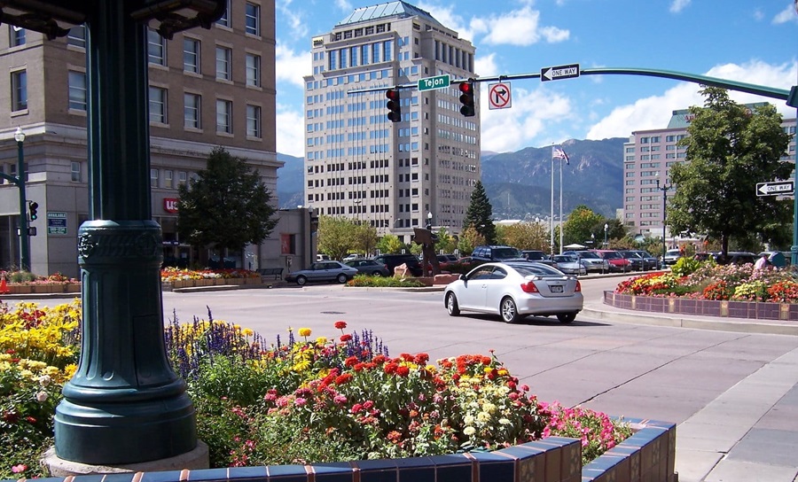 Image of Colorado Springs with flowers and tall building