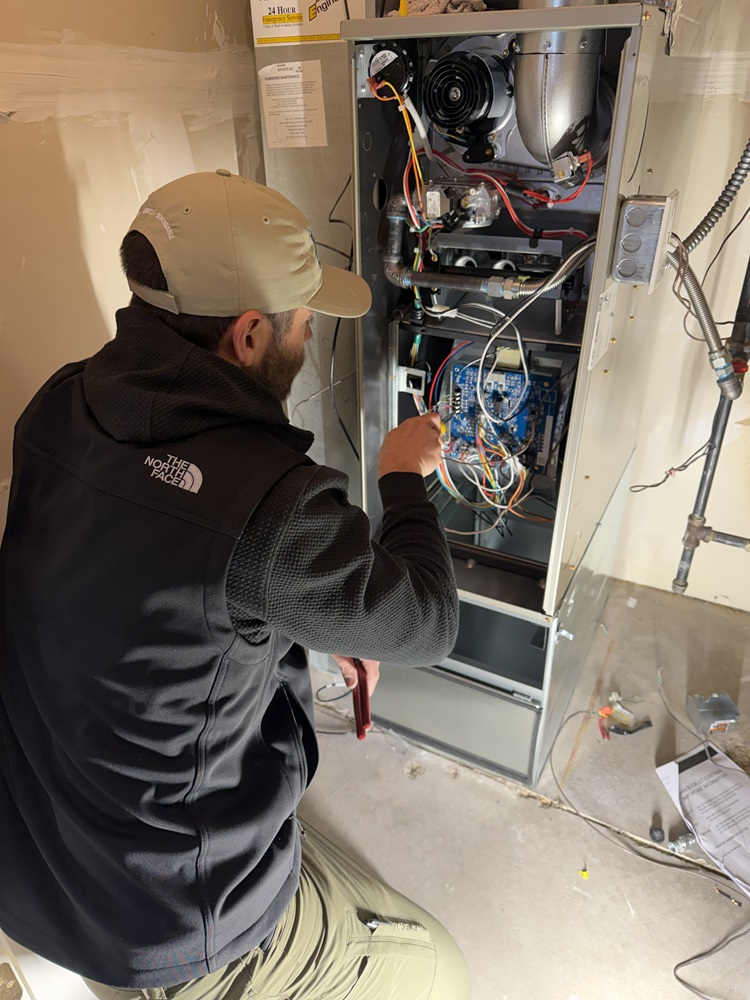 Man inspecting a furnace
